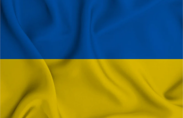 Photo of the Ukraine flag with folds.