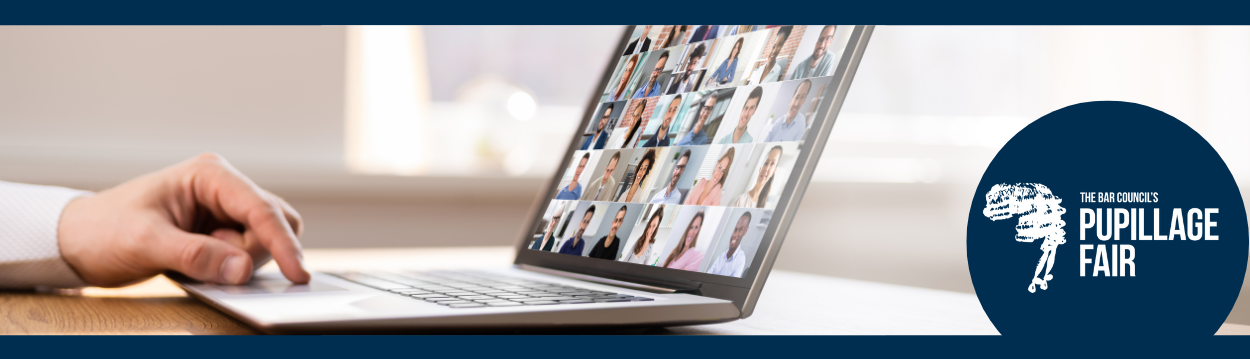 Close up photo of a person using a laptop  with a seminar of other online people on screen